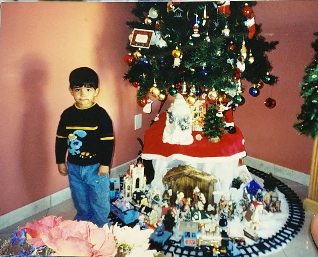 a young Juan Lam standing by the nascent Christmas City