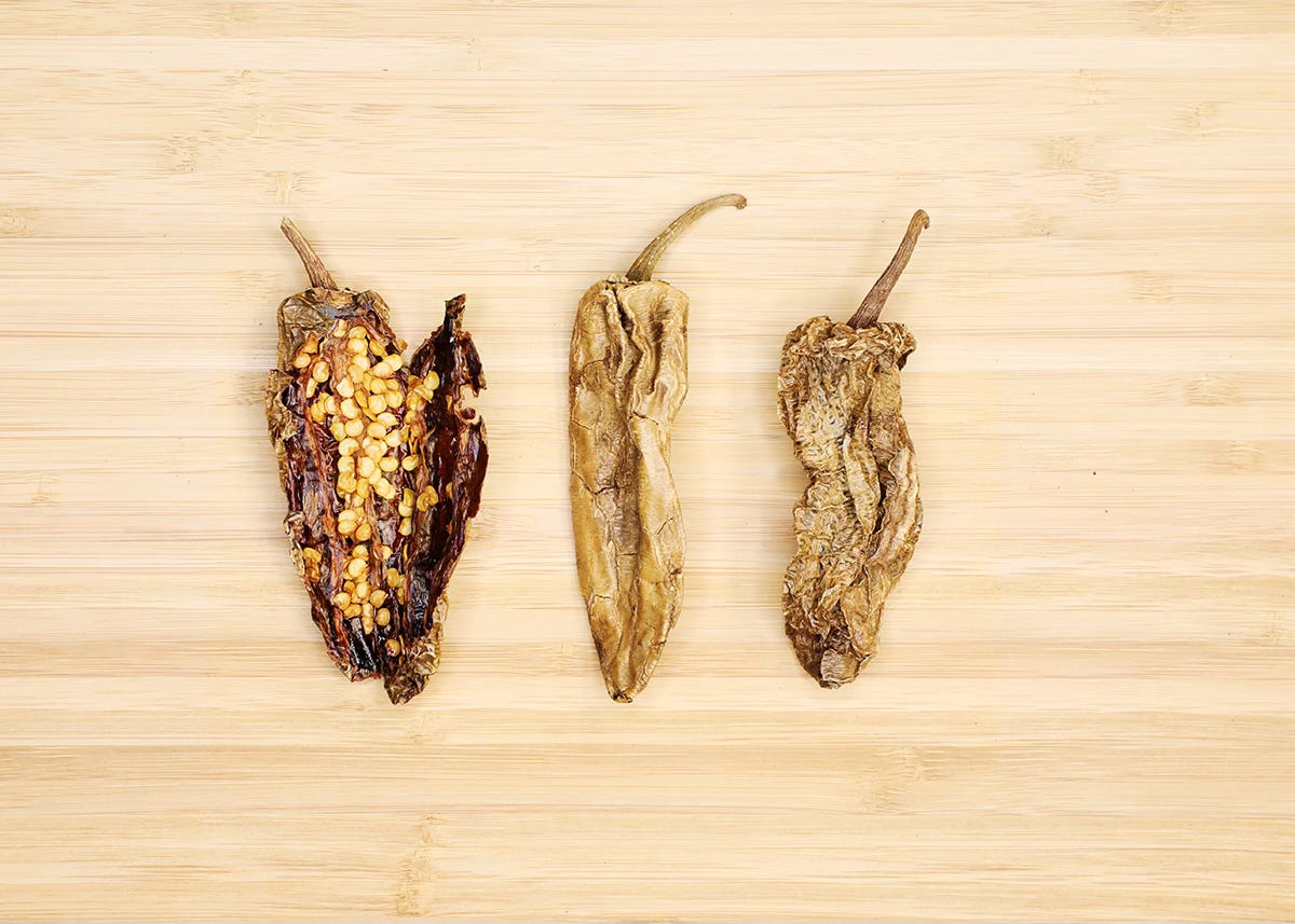 dried chipotle chiles on cutting board