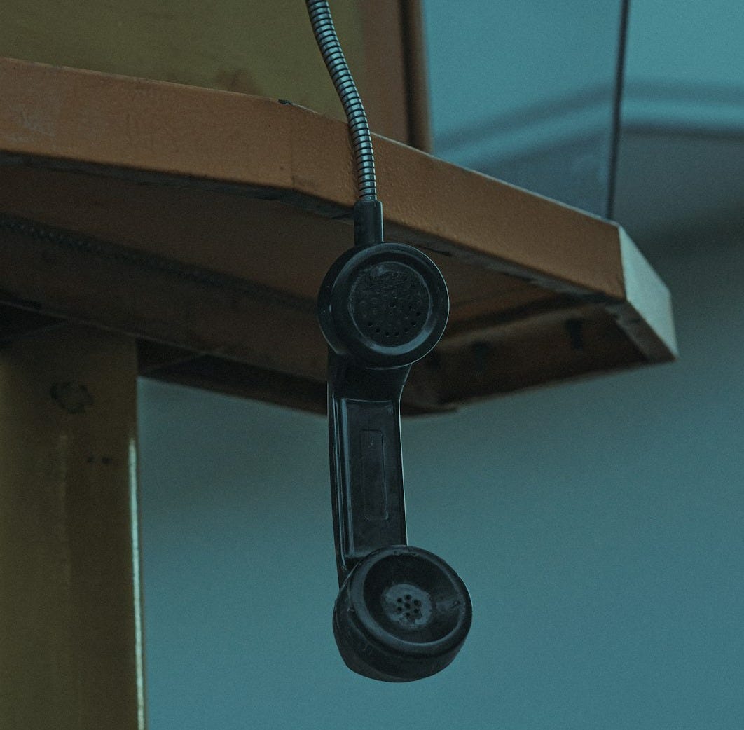 black and white wall mounted telephone