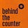 behind the counter