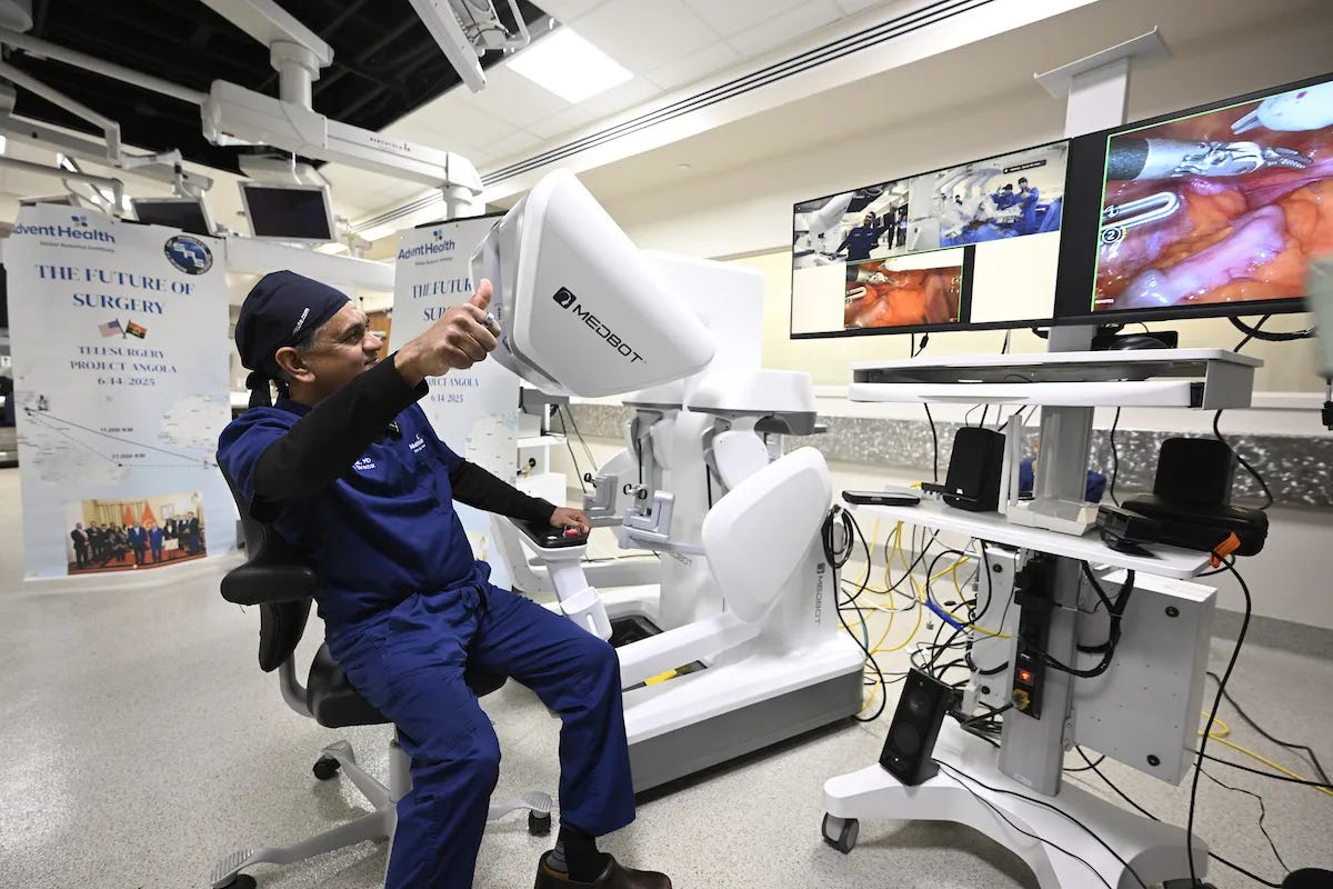 Dr. Vip Patel giving thumbs up to Angola telesurgery team