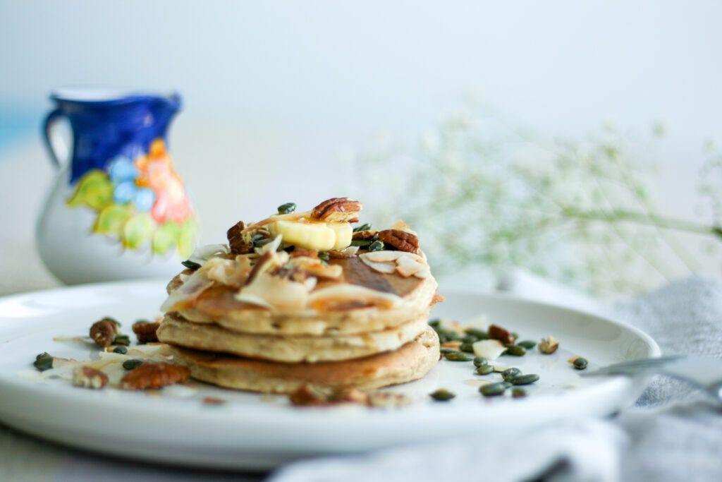 Pancakes with oats, yogurt, and maple syrup