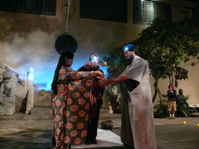A group of people performing a performance

Description automatically generated