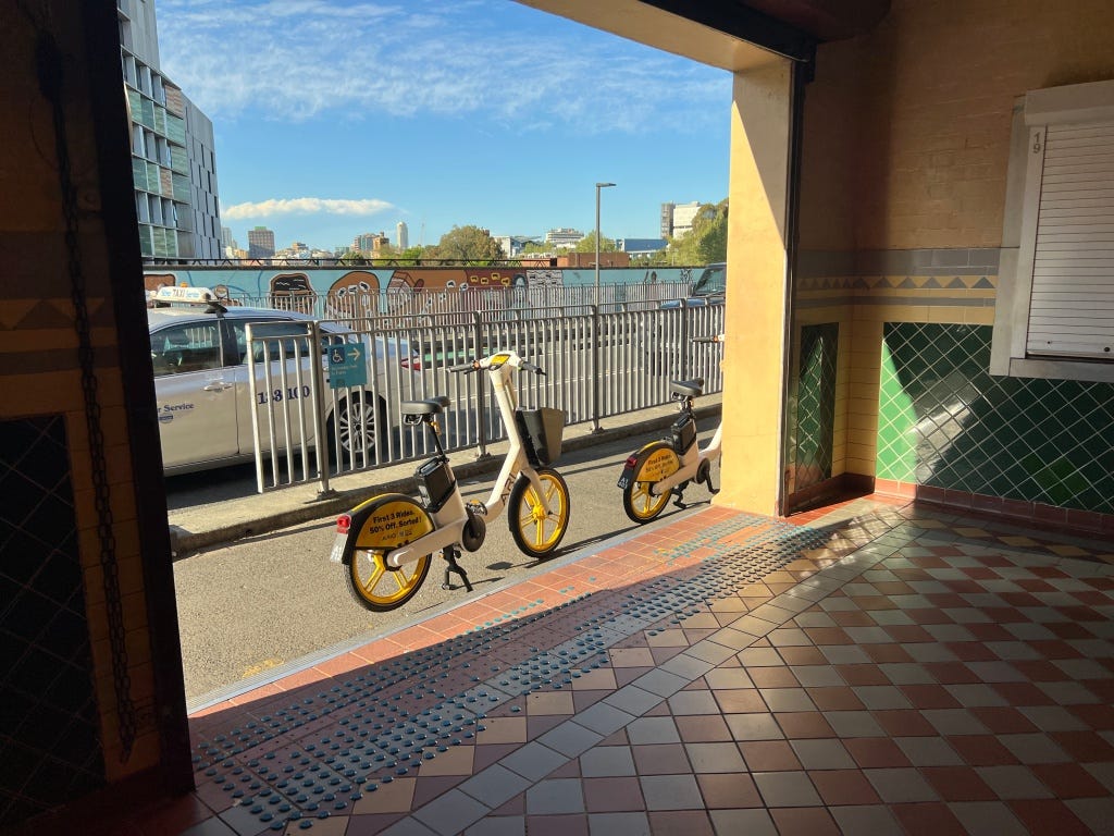 At Redfern Station, immediately in front of the entrance.