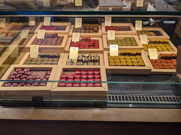 A group of travelers, and a case of fancy chocolates