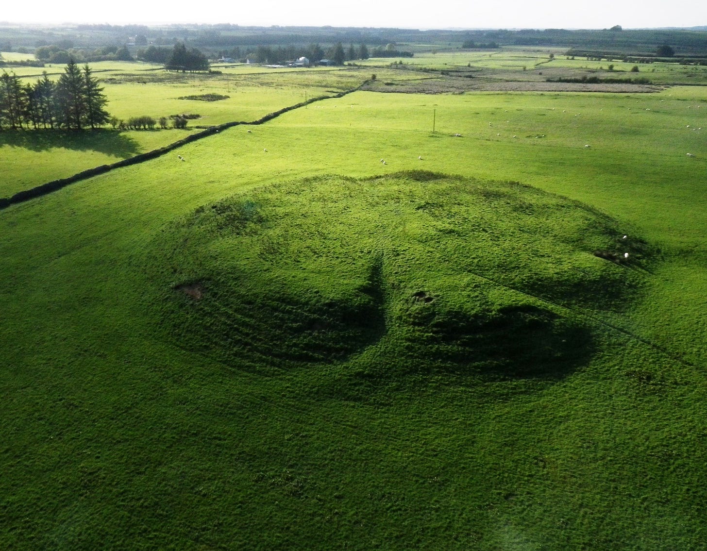 A view of the main mound in the Rathcroghan ritual complex. More details Aerial image of Rathcroghan Mound, by Joseph Fenwick, Creative Commons