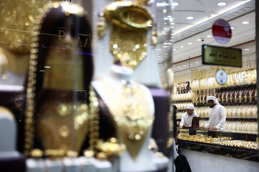 People shop for jewelry at the Gold Souk market in Dubai