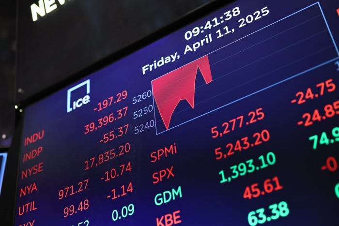 NYSE stock market ticker showing declining numbers.