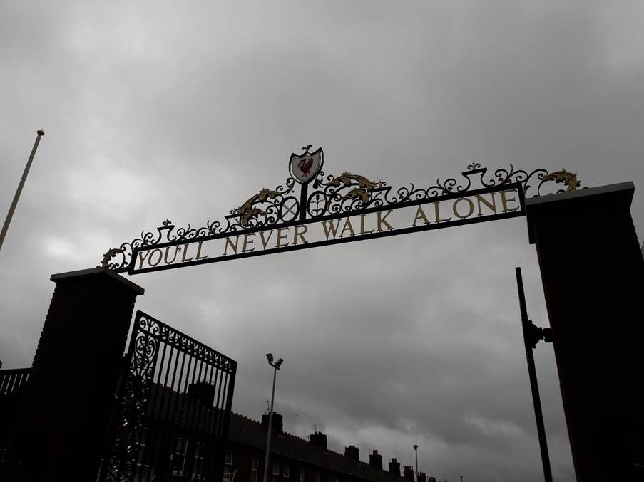 A gate with a sign over it

AI-generated content may be incorrect.