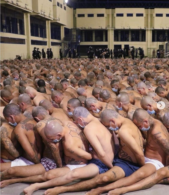 A group of men in a room with a crowd of people

AI-generated content may be incorrect.