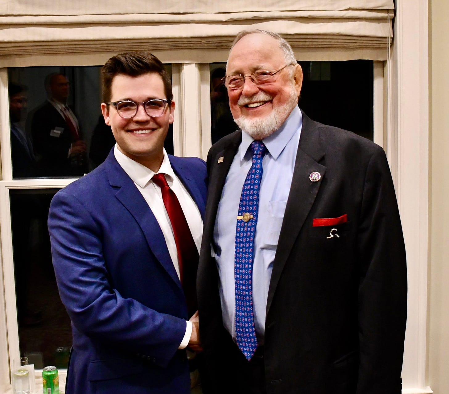 Zack Brown, the author of this newsletter, with his former boss, the late Congressman Don Young. They are standing and shaking hands.