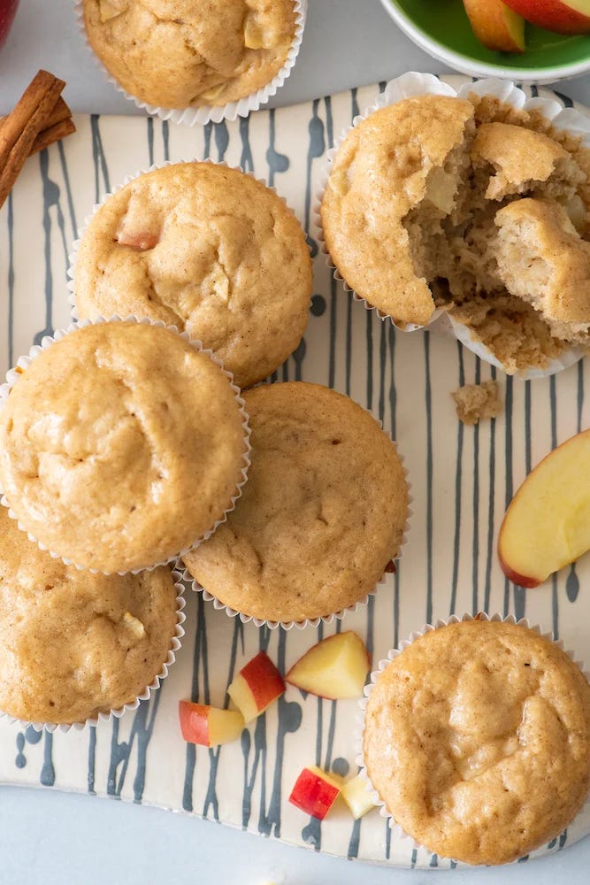 a platter filled with apple muffins and apple slices