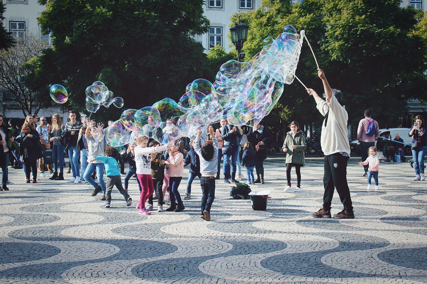 Children blowing bubbles Children blowing bubbles