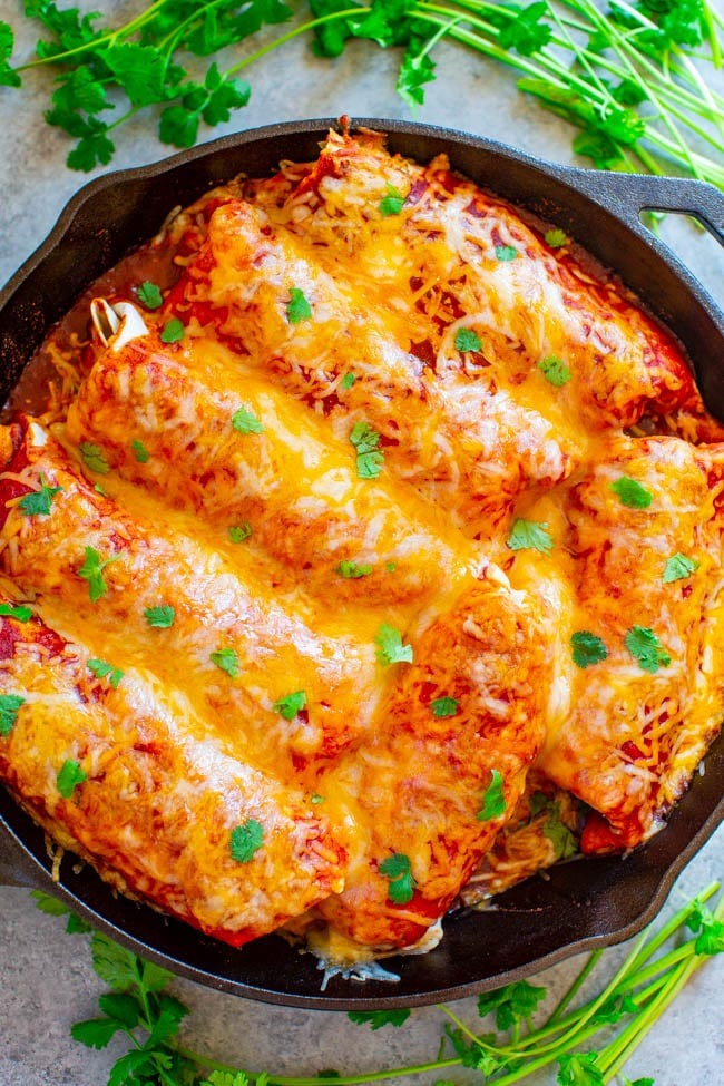 Loaded Smothered Beef Burritos — Mexican comfort food that's loaded with seasoned ground beef, refried beans, rice, and smothered with sauce and CHEESE!! Tastes BETTER than from a restaurant, plus these burritos are freezer-friendly and so EASY!! Loaded Smothered Beef Burritos — Mexican comfort food that's loaded with seasoned ground beef, refried beans, rice, and smothered with sauce and CHEESE!! Tastes BETTER than from a restaurant, plus these burritos are freezer-friendly and so EASY!!