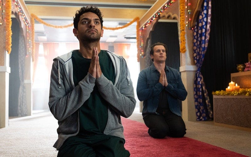 Karan Soni and Jonathan Groff kneel in prayer in A Nice Indian Boy