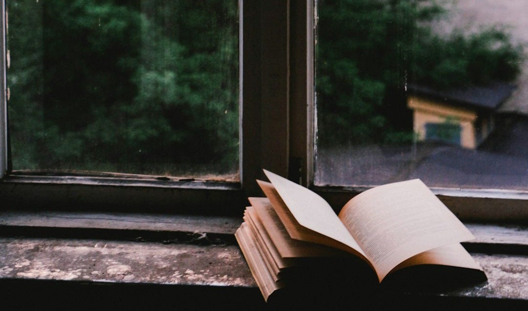 book near glass window book near glass window