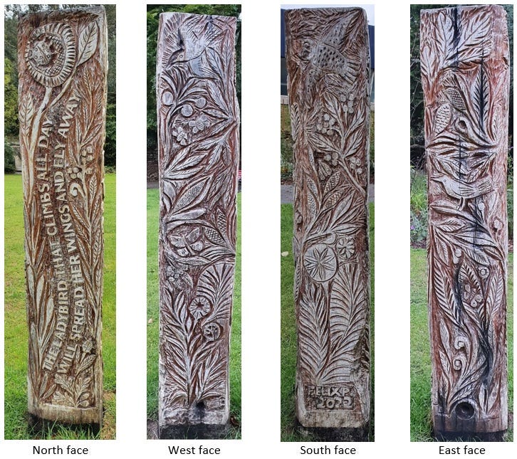 The four carved faces of the ‘Penryn Pillar’, featuring plant, insect and bird imagery, and an inscription that reads 'The ladybird that climbs all day / Will spread her wings and fly away'. It's signed 'Felix P 2022'.