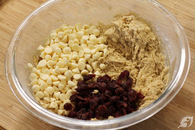 Step 7 - Stir in the white chocolate chips and dried cranberries by hand. Step 7 - Stir in the white chocolate chips and dried cranberries by hand.