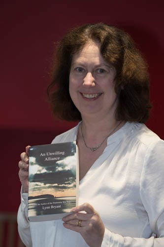 Lynn holds a book