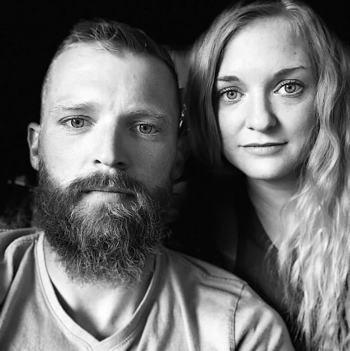 May be a black-and-white image of 2 people, beard, blonde hair and people smiling