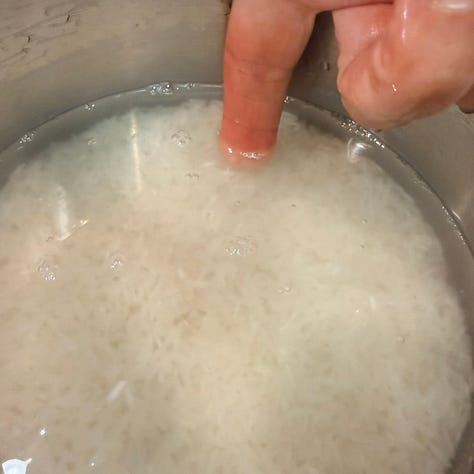 Measuring the water for rice