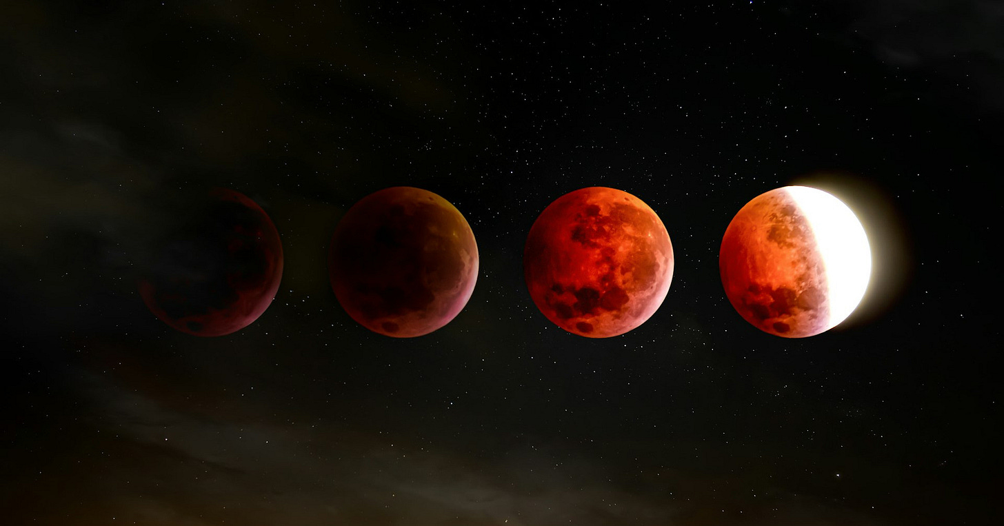 a group of red planets floating in the sky
