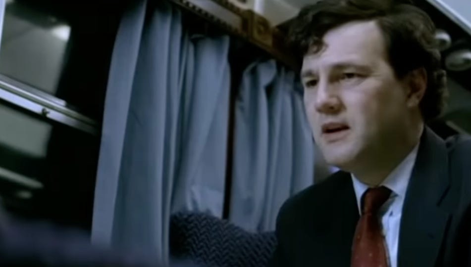 A person in a suit and tie

AI-generated content may be incorrect.