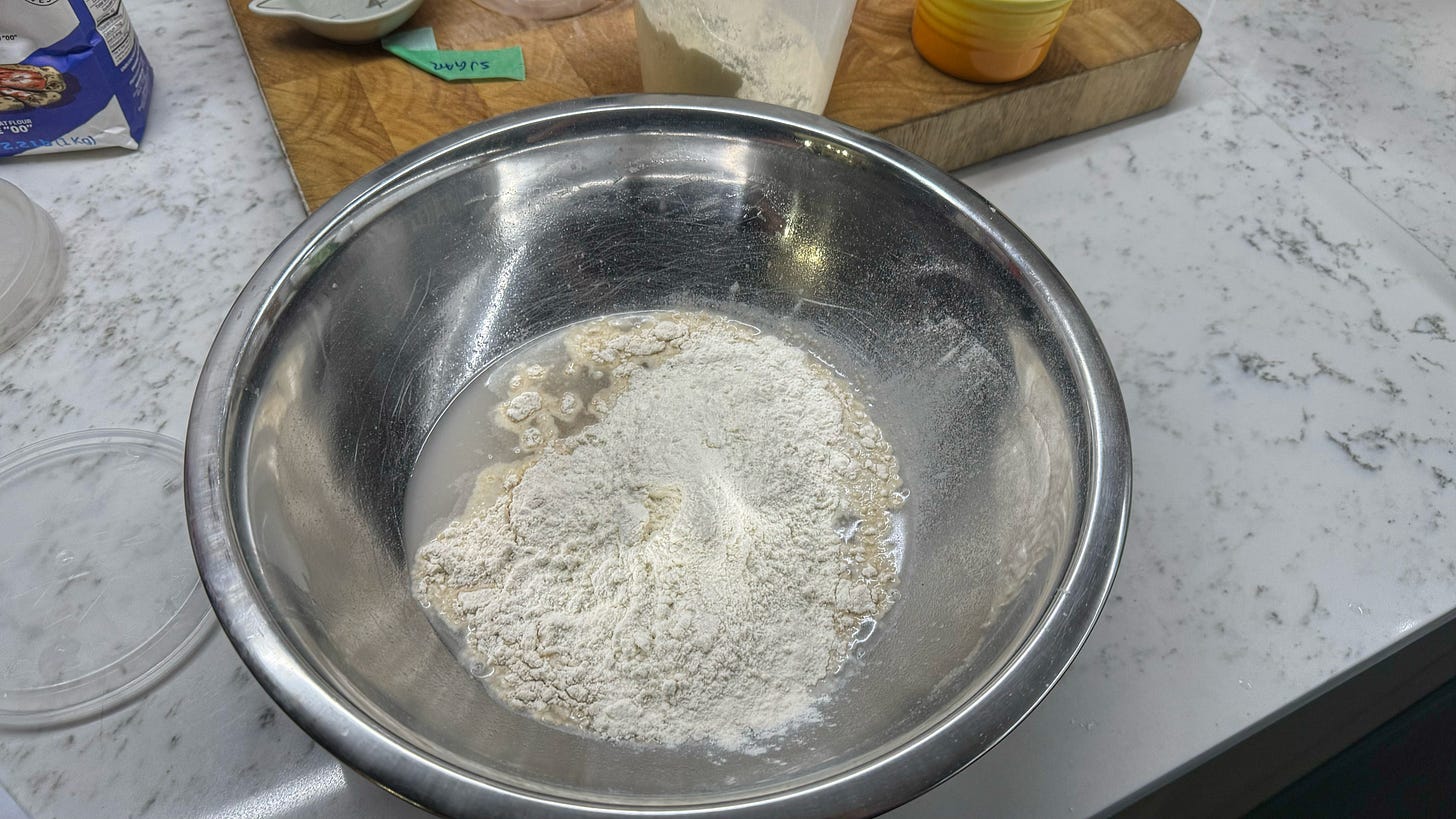 The same bowl, now with flour and crokkia added. It has not yet been smoothly incorporated