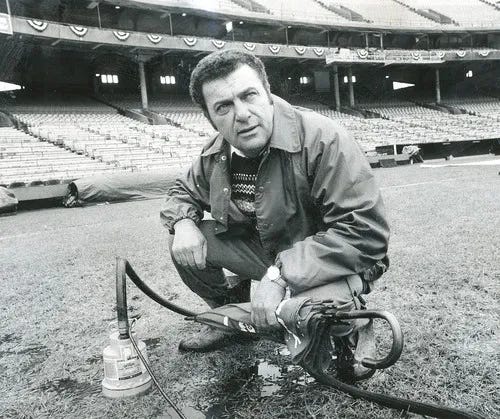 Pat Santarone kneels on the Memorial Stadium turf in 1980.