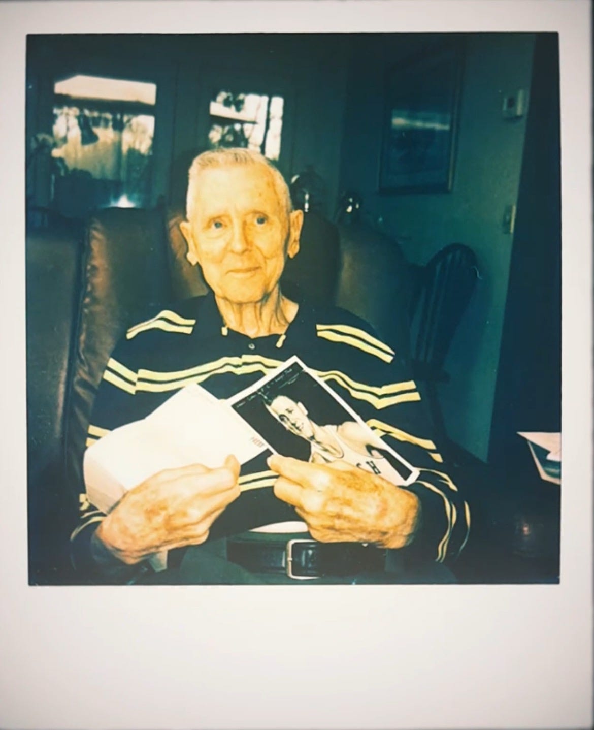 image of my grandfather, holding his college basketball headshot