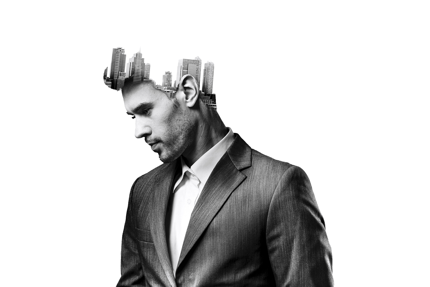 Double-exposure image of a founder with a cityscape inside his head, symbolizing mental load and energy drains. Double-exposure image of a founder with a cityscape inside his head, symbolizing mental load and energy drains.