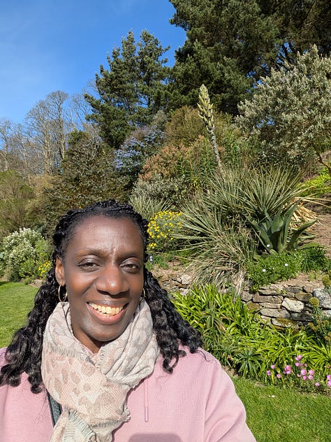 3 images: 1 of a harbour, 1 of a road leading to the harbour featuring a large tree stretching across the road. 1 of Adukeh the Poet wearing a pink top and smiling as she stands in a gardenin a garden