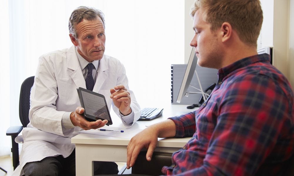 doctor and patient in consultation High Cholesterol Symptoms, What Is ...