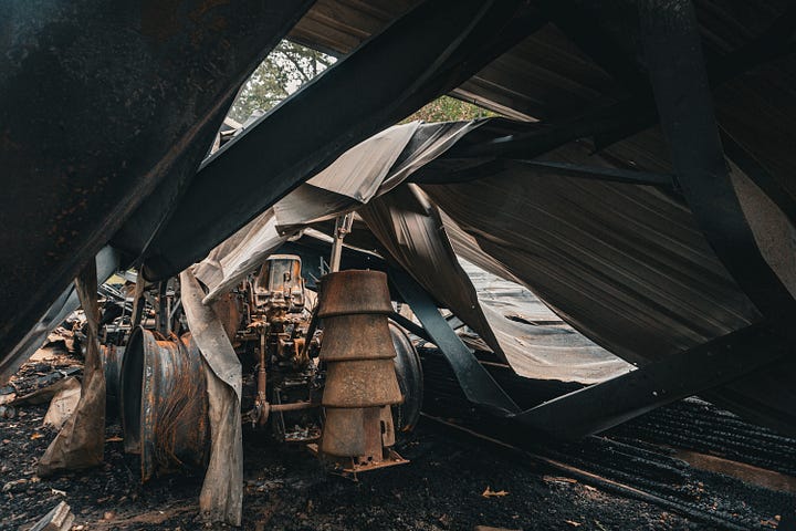 Tractor skeleton, mangled metal, pile of beans