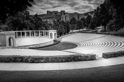 campus scenery including buildings, sculpture, outdoor amphitheater, flowers, Wooo Pig Sooie sign
