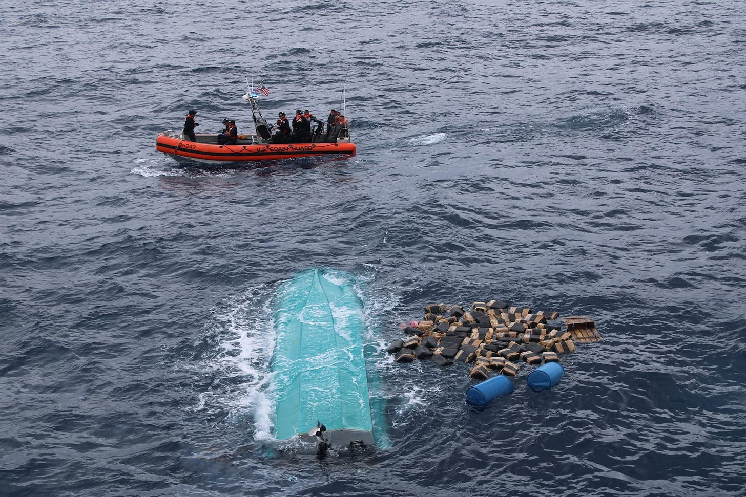 The crew of the U.S. Coast Guard Cutter Seneca recovers bales of cocaine after a suspected drug smuggling vessel capsized. The crew of the U.S. Coast Guard Cutter Seneca recovers bales of cocaine after a suspected drug smuggling vessel capsized.