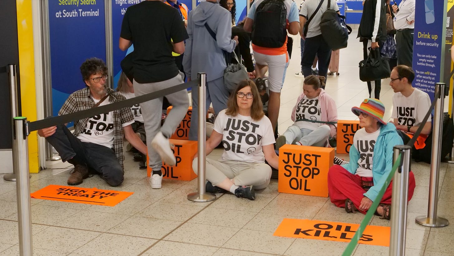 Just Stop Oil neotoddlers block the departure gates at Gatwick Airport (Image credit: Just Stop Oil)