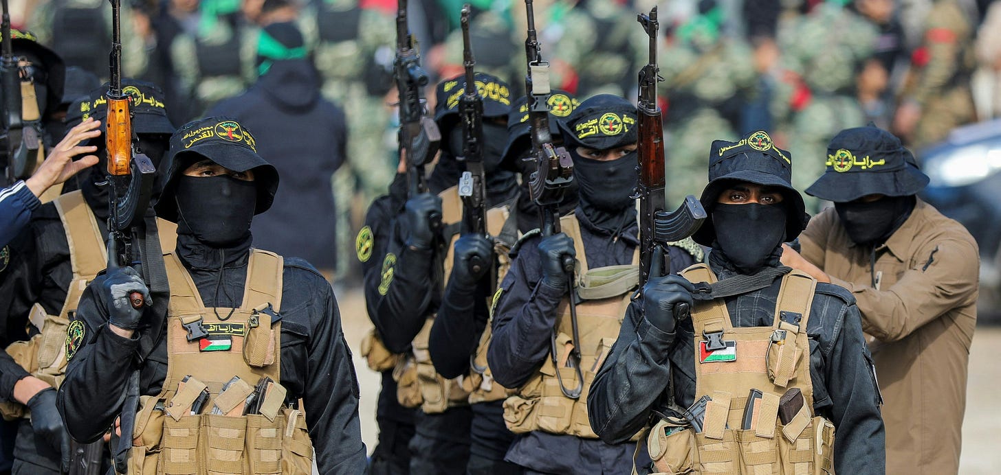 Palestinian Islamic Jihad militants stand guard before the handover of hostages who had been held in Gaza since the deadly October 7, 2023 attack, to members of the International Committee of the Red Cross (ICRC) as part of a ceasefire and a hostages-prisoners swap deal between Hamas and Israel, in Gaza City, January 25, 2025. REUTERS/Dawoud Abu Alkas  