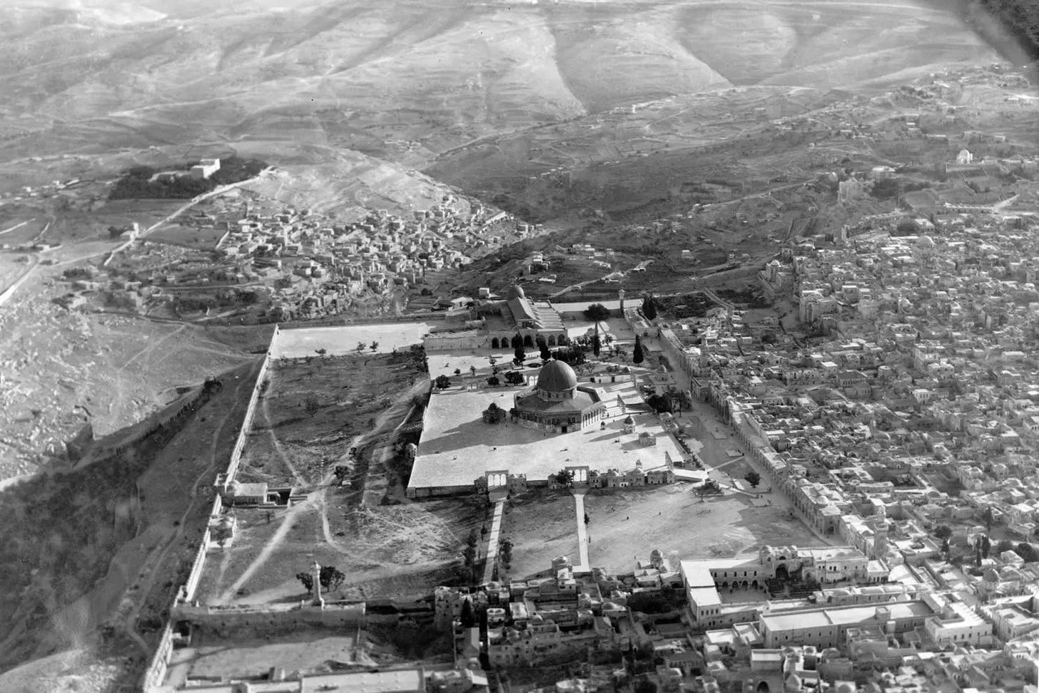 An aerial view of the old city of Jerusalem showing the Dome of the Rock and the surrounding quarters, taken from the north in the 1930s.