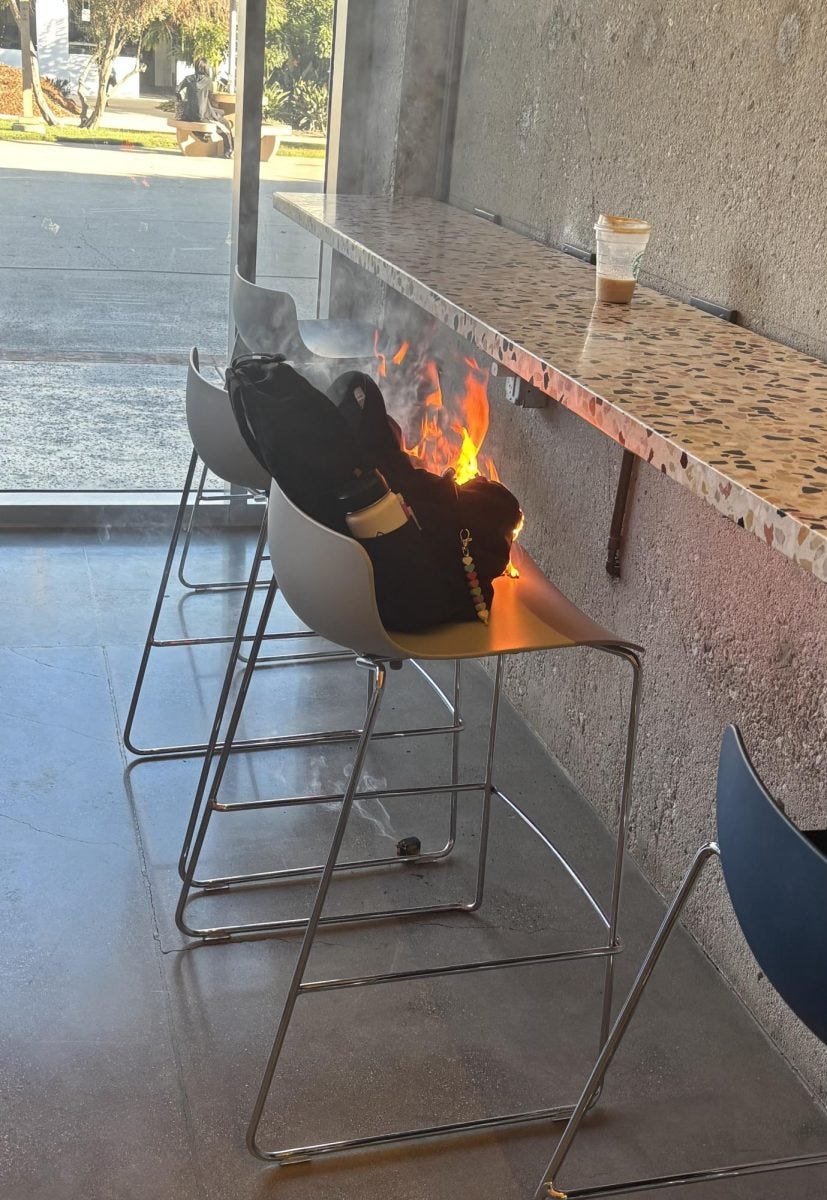 A backpack bursts into flames at El Cappuccino on Wednesday, Oct. 29. The fire caused the cafe to close early while clean up efforts are underway. (Ashlyn Zeutzius | The Union )