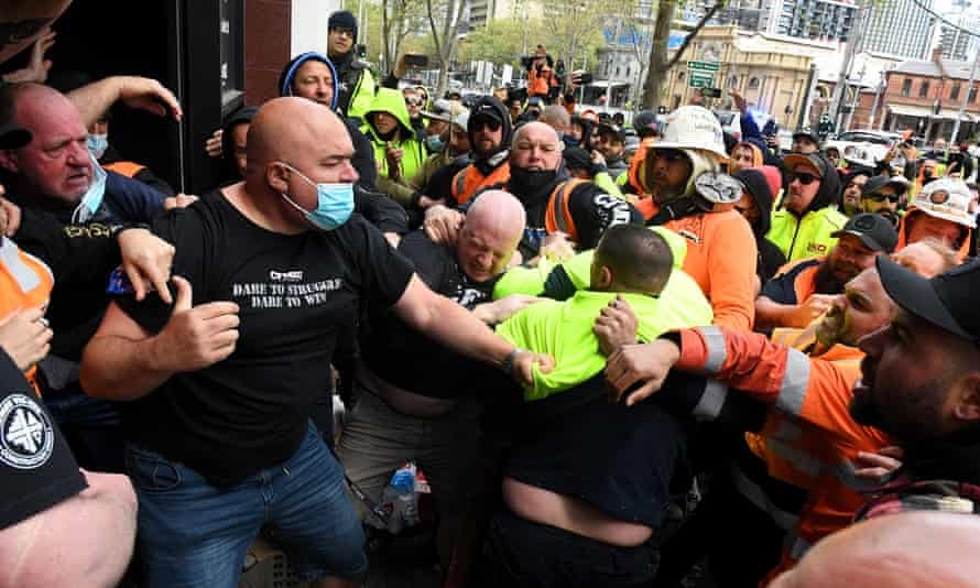 Construction workers clash with unionists at a protest at CFMEU headquarters in Melbourne over vaccine mandates. Construction workers clash with unionists at a protest at CFMEU headquarters in Melbourne over vaccine mandates.
