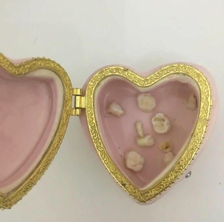 Teeth in heart shaped box 