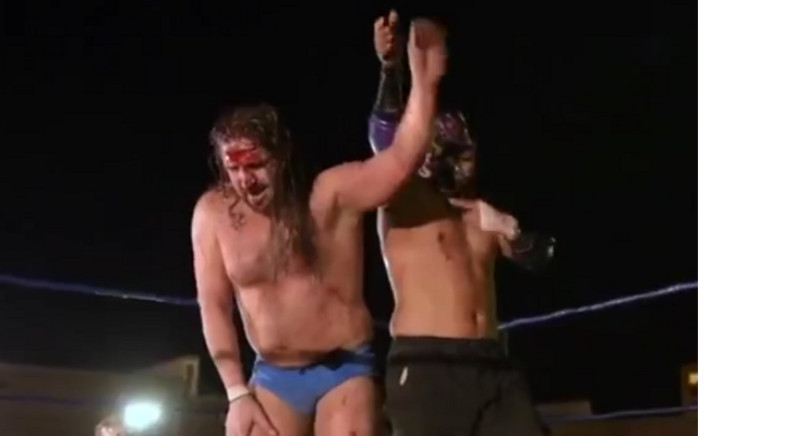 [Screenshot: Aeroboy raises Wayne's arm]