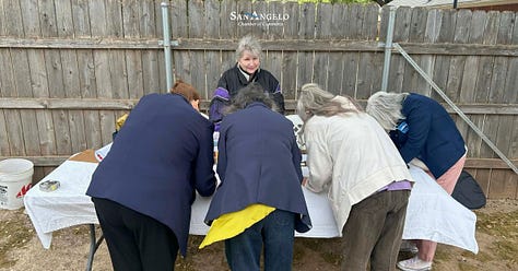 Pictures of a shed in the backyard, a ribbon cutting event. 