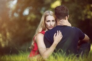 Man and woman who look like a couple hugging