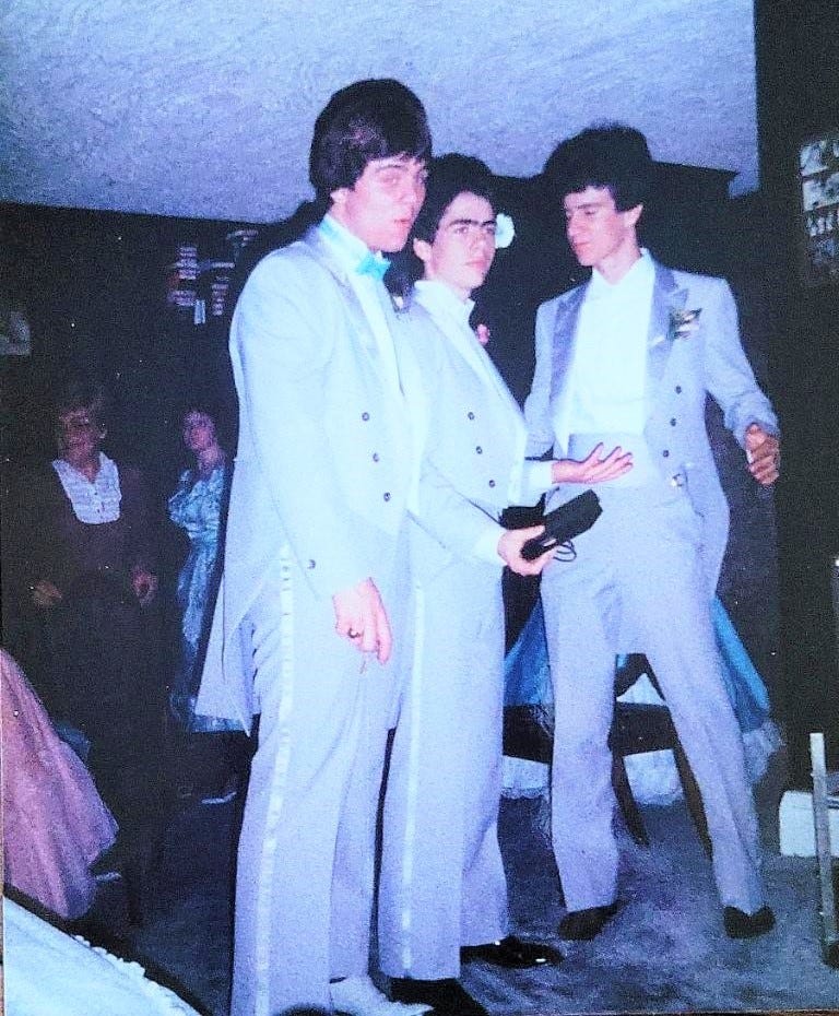 Three high school senior guys in their circa 1984 tuxes on the dance floor at the prom Three high school senior guys in their circa 1984 tuxes on the dance floor at the prom