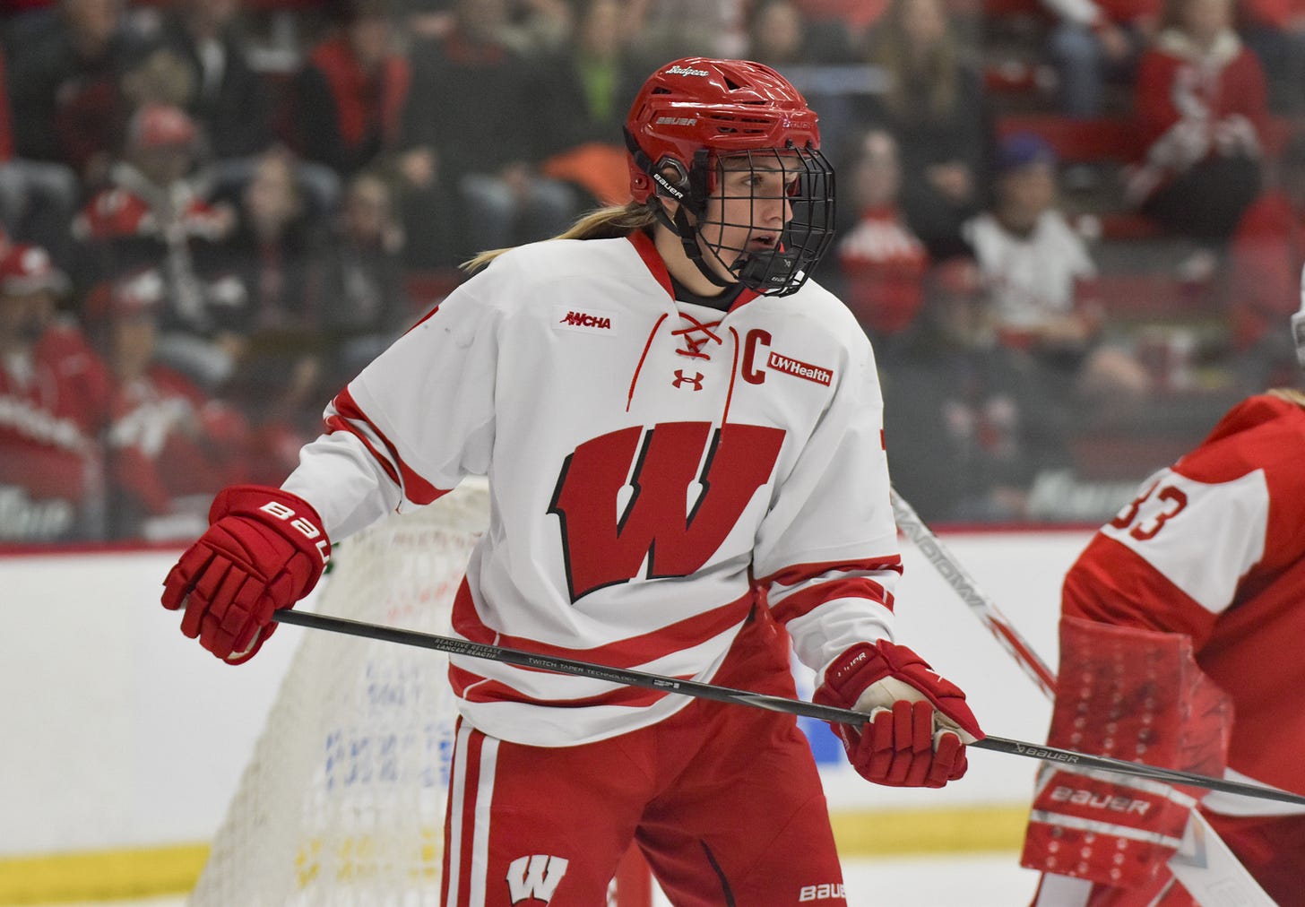 Kelly Gorbatenko near the Boston University Terriers goaltender
