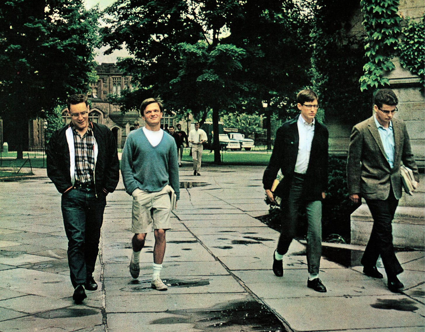 The caption for this Take Ivy photograph reads “To classrooms. Each of these four Ivy Leaguers is dressed according to...