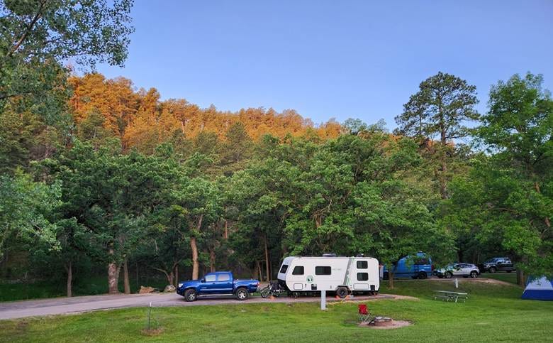 A camper and truck parked in a forest
AI-generated content may be incorrect. A camper and truck parked in a forest
AI-generated content may be incorrect.