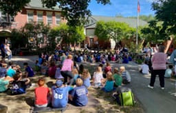 students seated outdoors for REP
